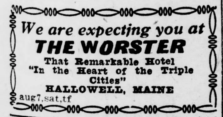 Text-only advertisement for a [unclear word], framed by a decorative chain-like border, with lines of large and bold type naming the [unclear word] and its town, and a small code line at the lower left.